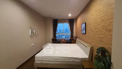 Cozy bedroom with city view, wooden accent wall, and modern decor.