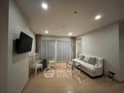 Modern living room with elegant decor and city view, featuring a cozy sofa and dining area.