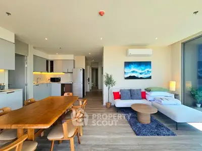 Spacious modern living room with open kitchen and stylish decor