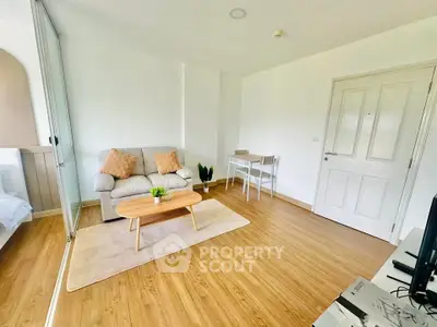 Bright and cozy living room with modern furniture and wooden flooring