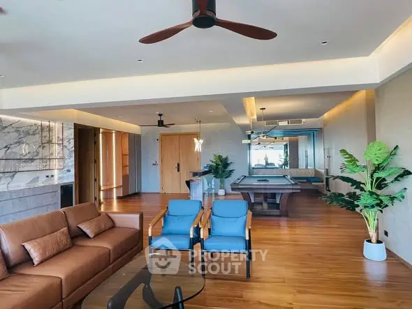 Spacious modern living room with pool table and elegant decor