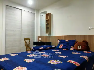 Cozy bedroom with stylish decor and ample storage space, perfect for relaxation and comfort.