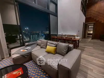 Luxurious living room with stunning city view and modern furniture