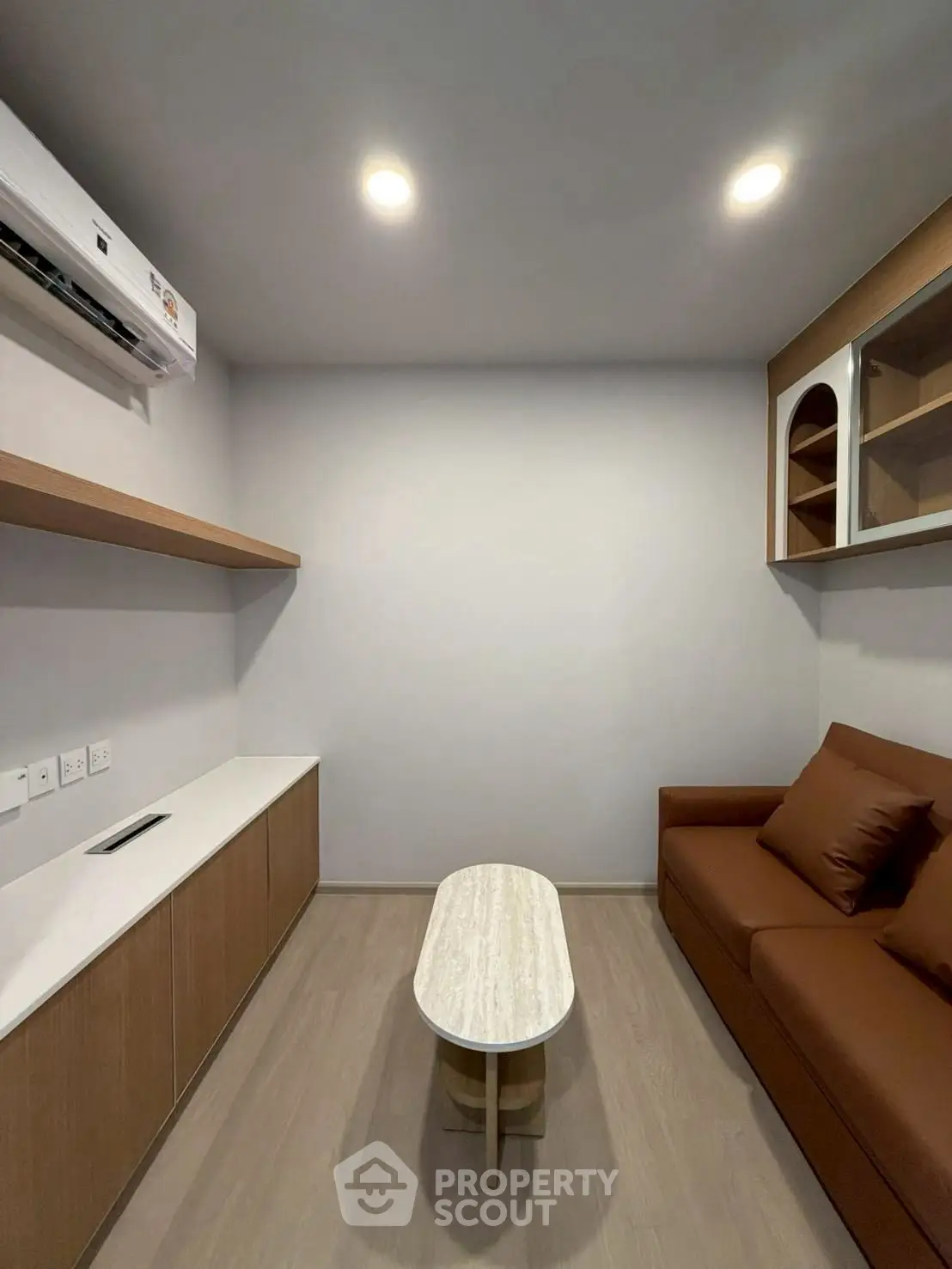 Modern minimalist living room with sleek furniture and ambient lighting