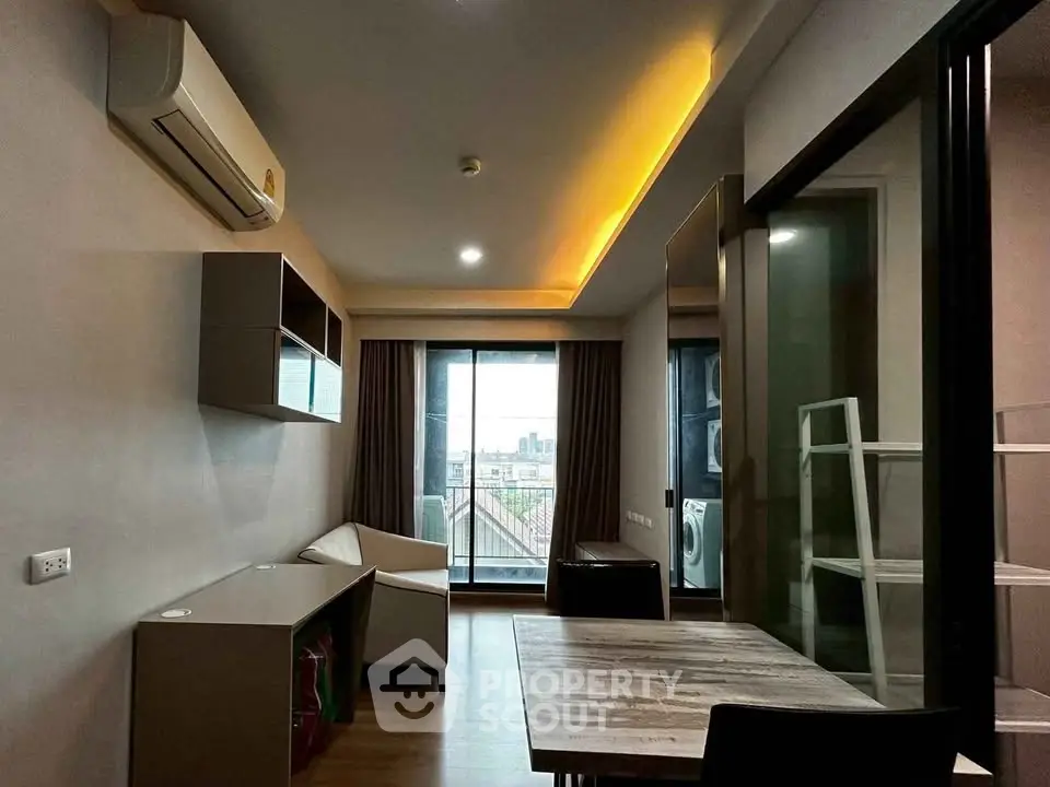 Modern living room with city view, featuring sleek furniture and ambient lighting.