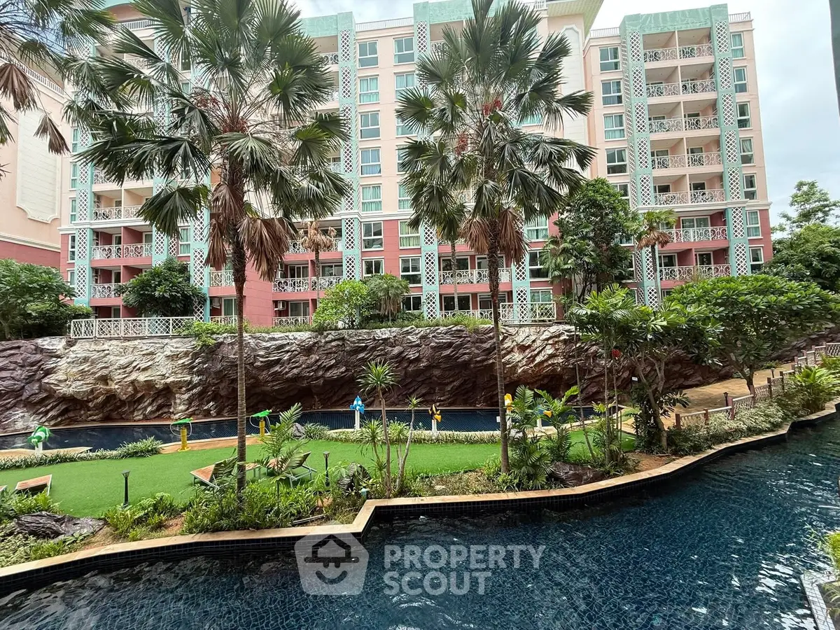 Luxurious residential building with lush garden and pool view