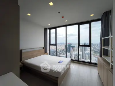 Modern bedroom with stunning city view and large windows