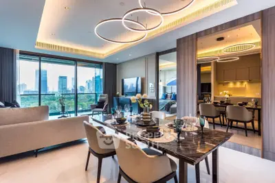 Luxurious modern living room with city view, elegant dining area, and stylish lighting fixtures.