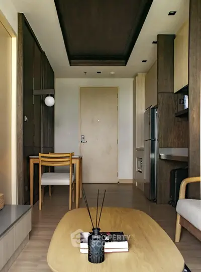 Modern living room with stylish furniture and open kitchen layout