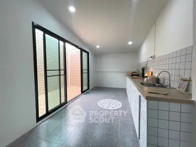 Spacious modern kitchen with sleek design and ample natural light
