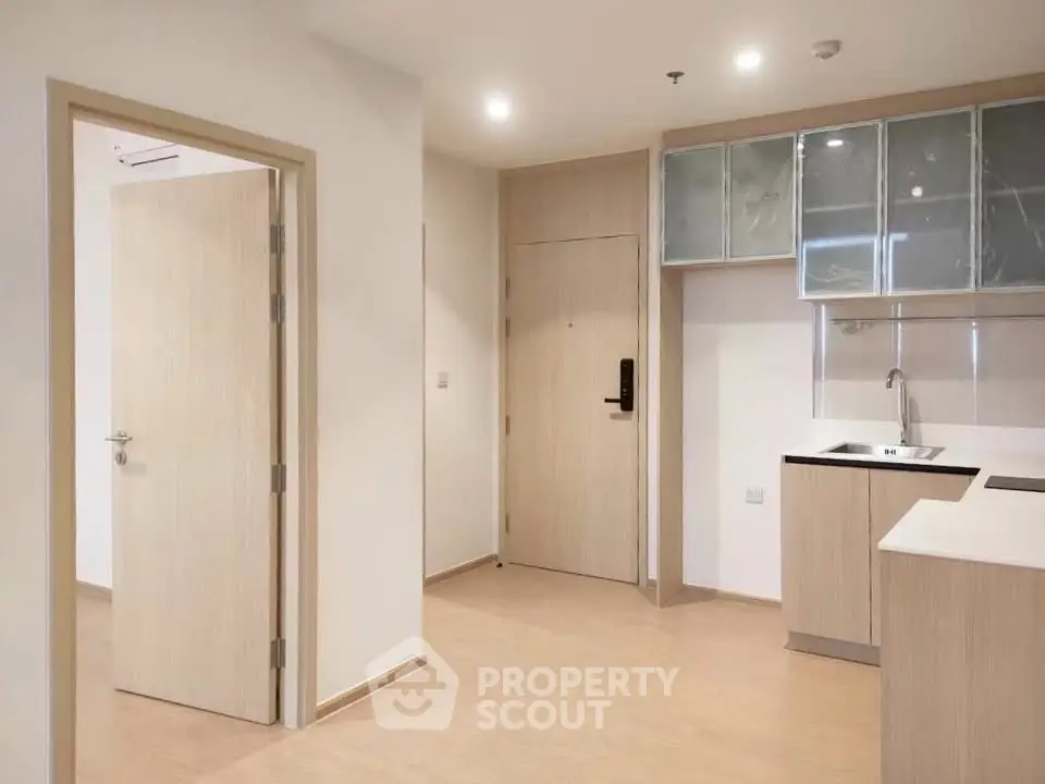 Modern minimalist kitchen with sleek cabinetry and open layout