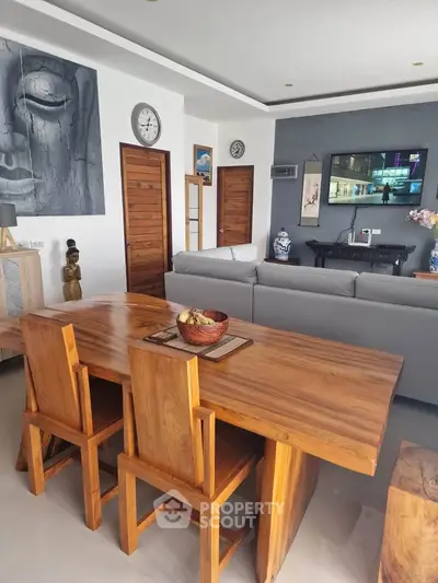 Modern living room with wooden dining table and stylish decor