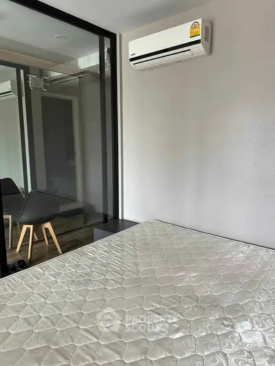 Modern bedroom with air conditioning and minimalist decor