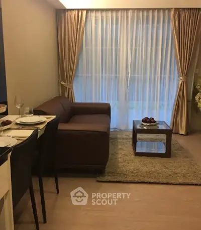 Cozy living room with elegant curtains and modern furniture