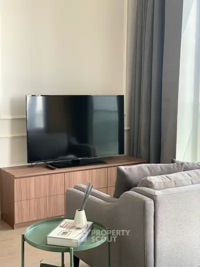 Modern living room with sleek TV setup and stylish furniture