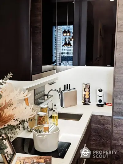 Sleek modern kitchen with high-end finishes, featuring dark wood cabinets, white countertops, and a city view through the window, perfect for urban living.