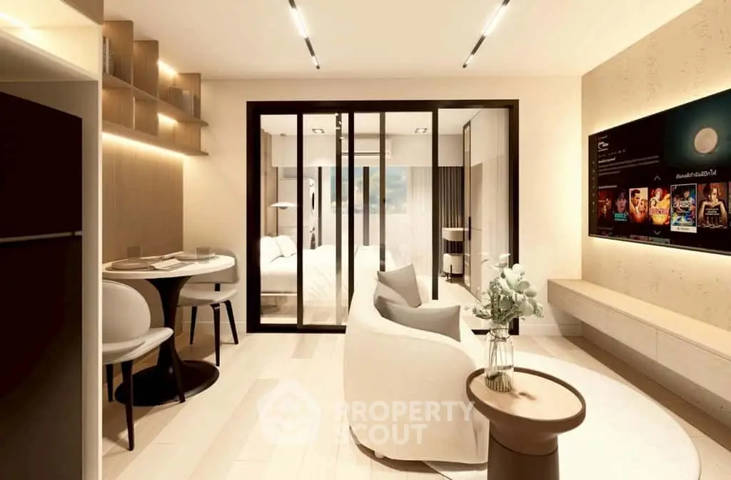 Modern open-plan living room with elegant decor and sliding glass doors leading to a cozy bedroom.