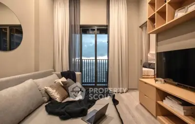 Modern living room with cozy sofa, large window, and stylish decor in a high-rise apartment.