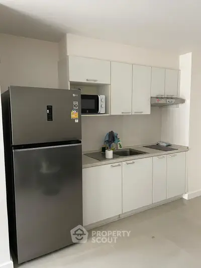 Modern kitchen with sleek appliances and minimalist design