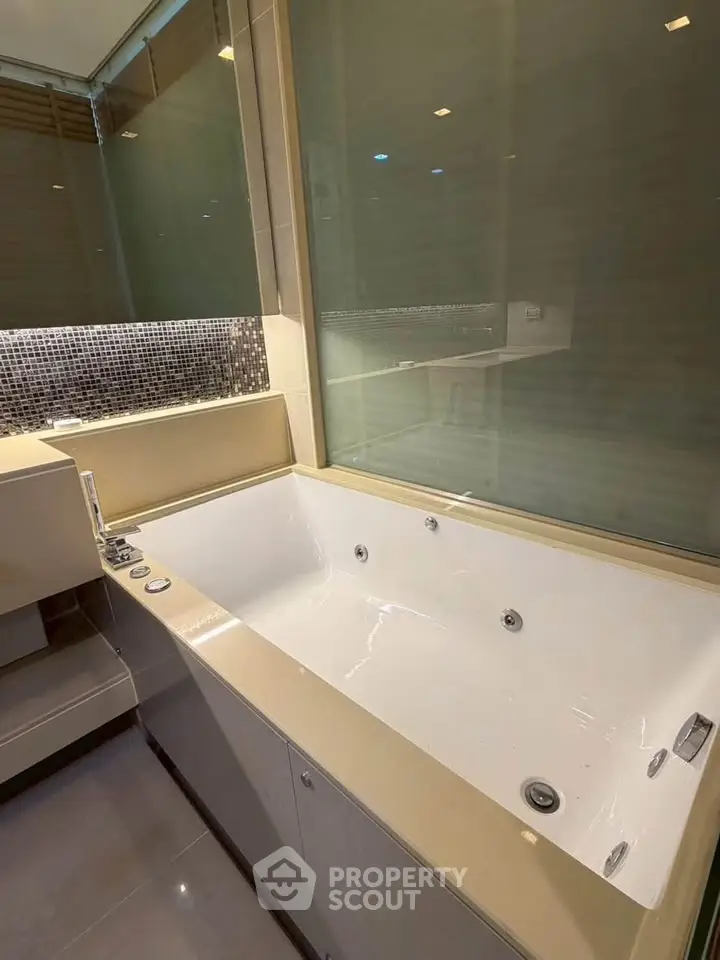 Luxurious bathroom with a modern bathtub and elegant tile accents.