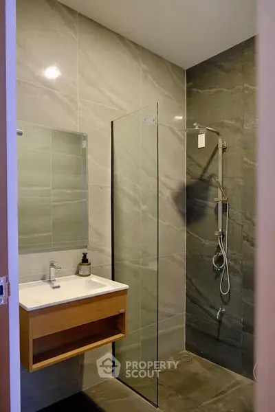 Modern bathroom with sleek design and glass shower partition