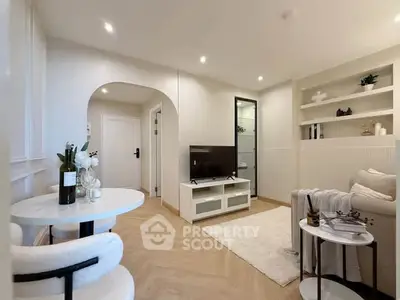 Modern living room with elegant decor and cozy seating area, perfect for relaxation and entertainment.