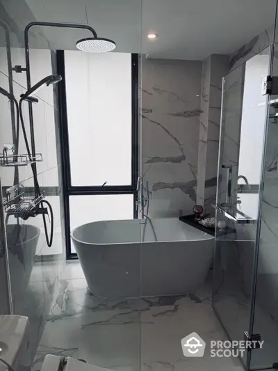 Luxurious modern bathroom with freestanding tub and marble tiles