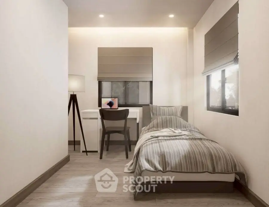 Cozy modern bedroom with single bed and study desk, perfect for minimalist living.