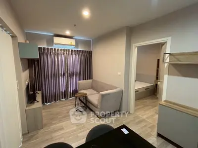 Modern living room with cozy sofa and stylish decor in a contemporary apartment.