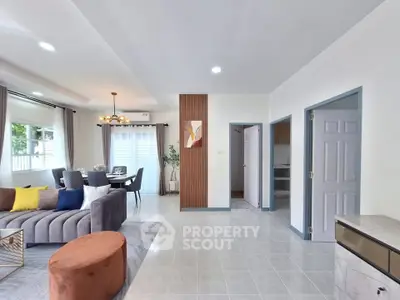 Spacious modern living room with stylish decor and dining area, perfect for family gatherings.