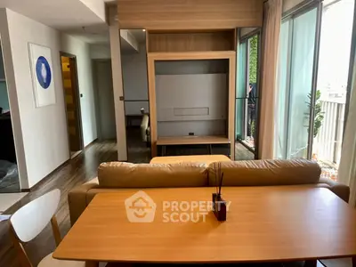 Modern living room with stylish furniture and large windows for natural light