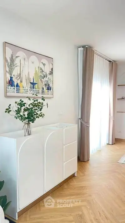 Bright and airy living room with modern decor and large window