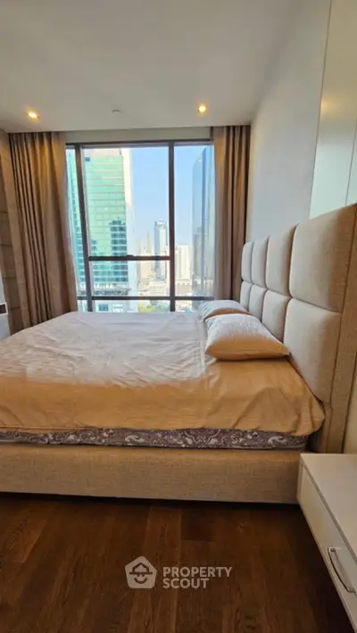 Luxurious bedroom with stunning city view and modern decor