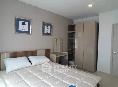 Modern bedroom with stylish decor and ample storage space