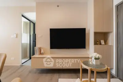 Modern living room with sleek TV setup and stylish wooden furniture