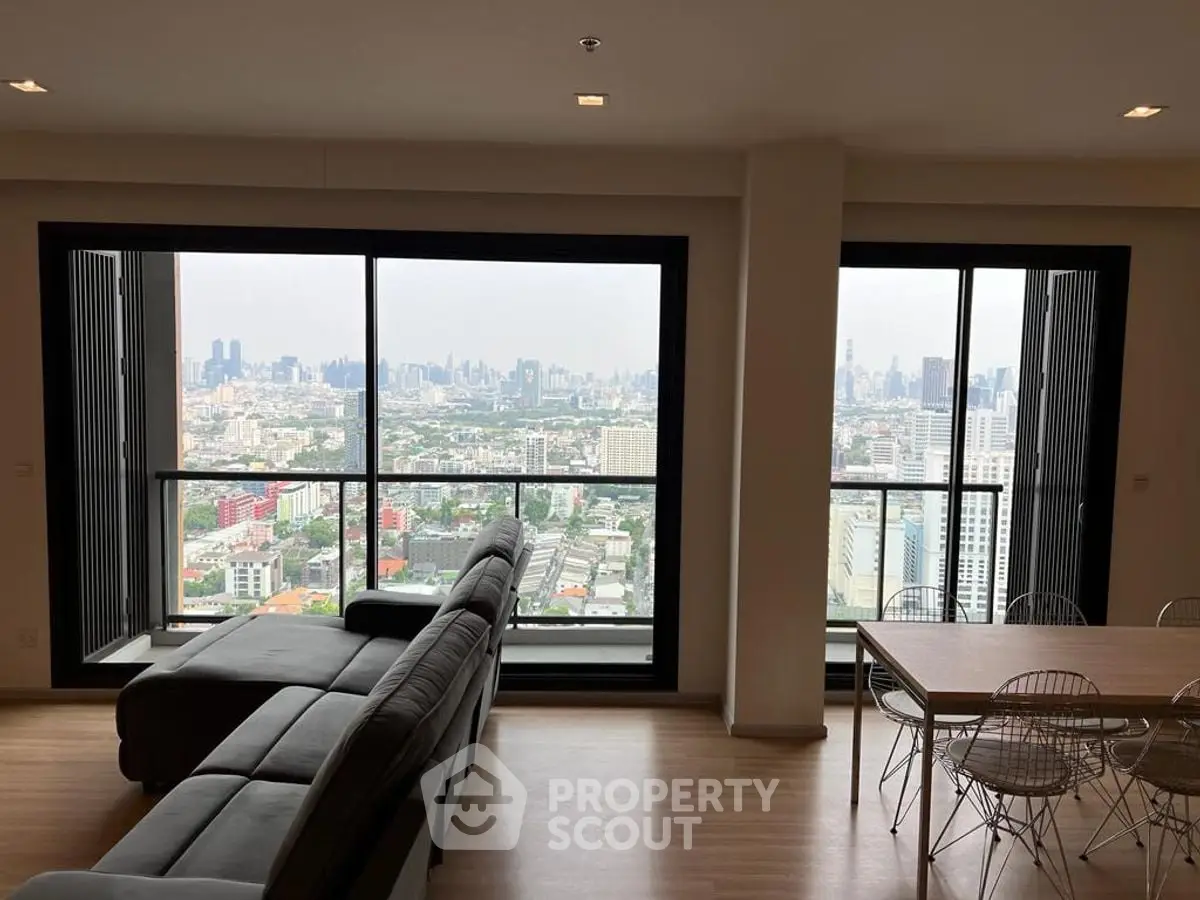 Spacious living room with stunning city view and modern furniture