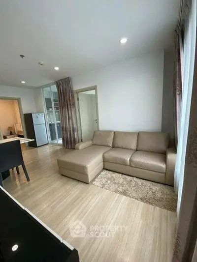 Spacious living room with modern furniture and natural light