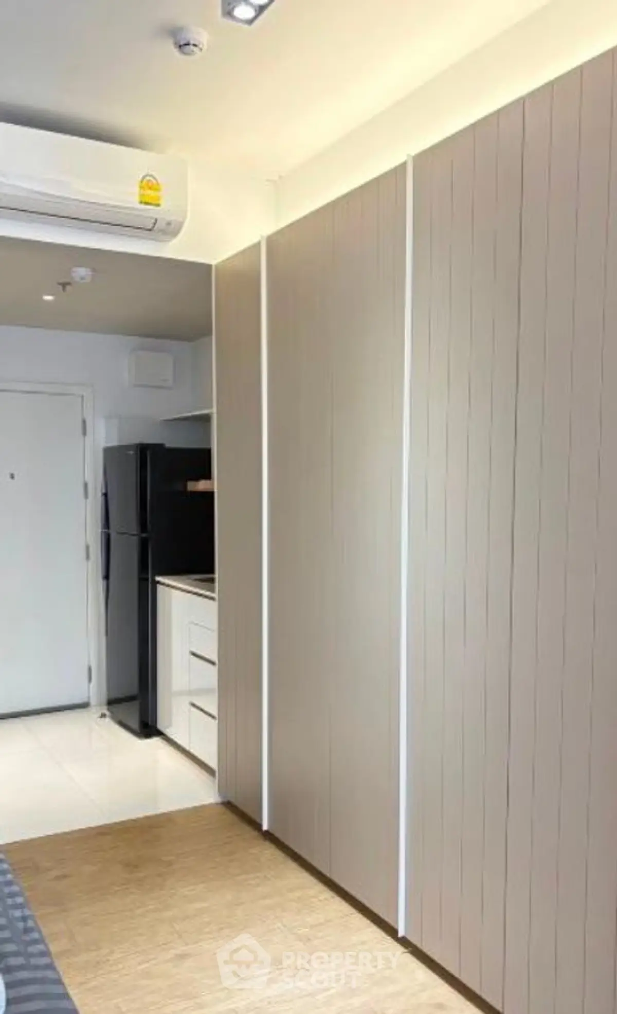 Modern apartment interior with sleek kitchen and ample storage space