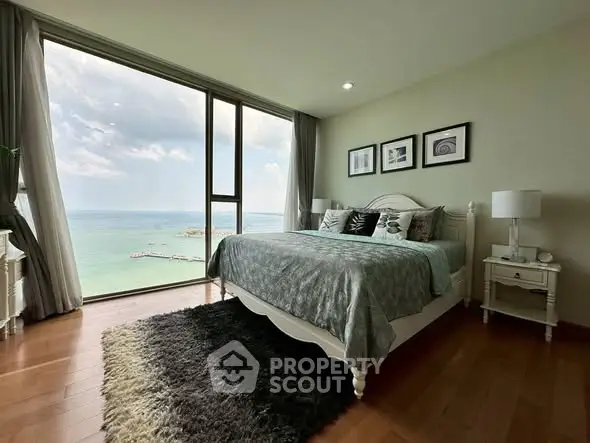 Luxurious bedroom with stunning ocean view and elegant decor