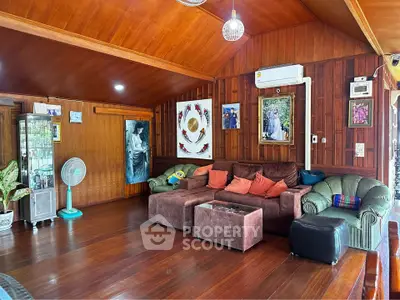 Spacious wooden living room with cozy seating and vibrant decor