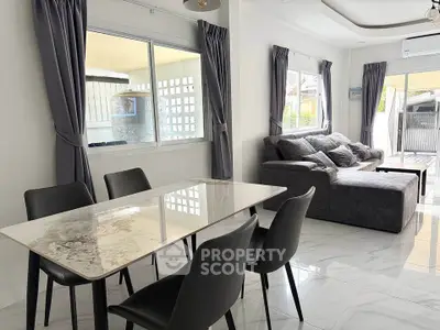 Modern living room with elegant dining area and stylish furniture