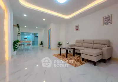 Spacious modern living room with elegant lighting and sleek marble flooring