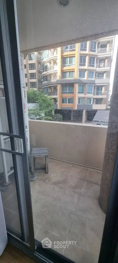 Charming balcony with urban view, perfect for relaxation and enjoying city life.