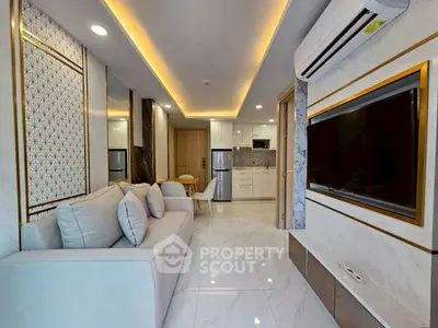 Modern living room with sleek design, open kitchen, and stylish decor