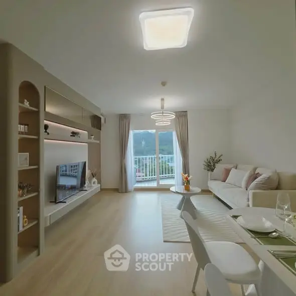 Spacious modern living room with elegant decor and balcony view