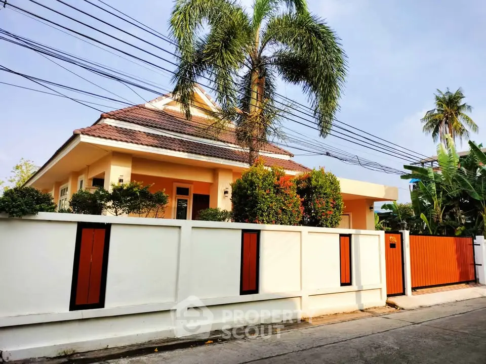 Charming suburban house with lush greenery and modern design, perfect for family living.