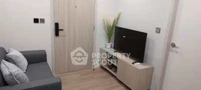Cozy living room with modern decor and sleek TV setup