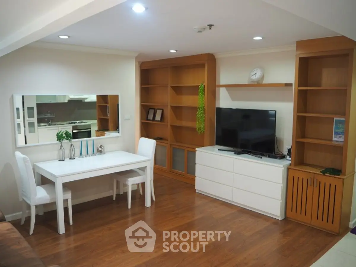 Spacious living room with modern furniture and wooden flooring