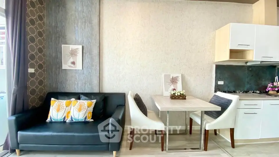 Modern living room with stylish decor and open kitchen layout, perfect for contemporary living.