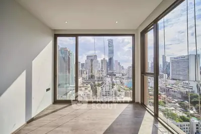 Stunning corner unit with panoramic city views and floor-to-ceiling windows.